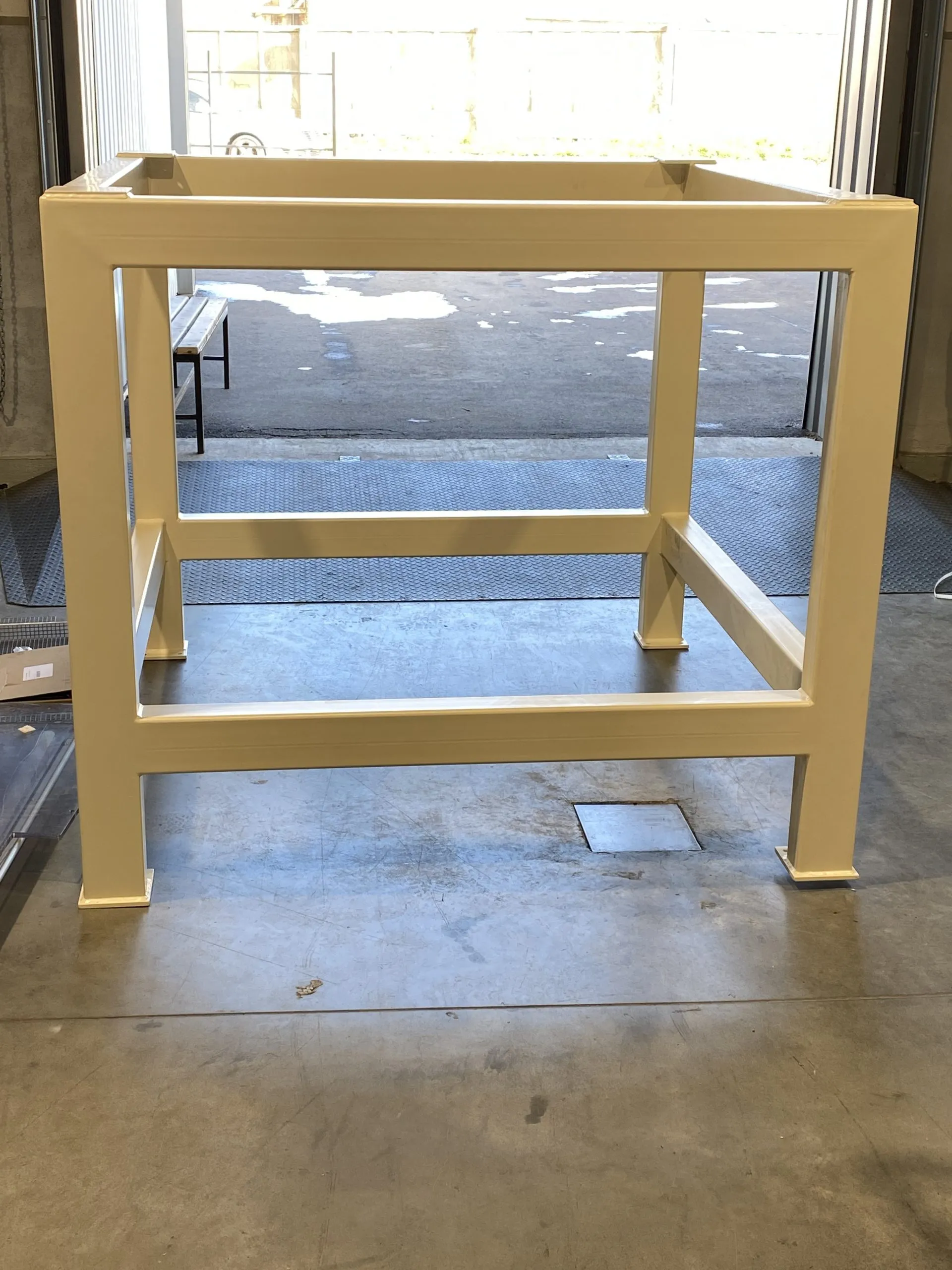 Large fabricated steel assembly in an industrial workshop